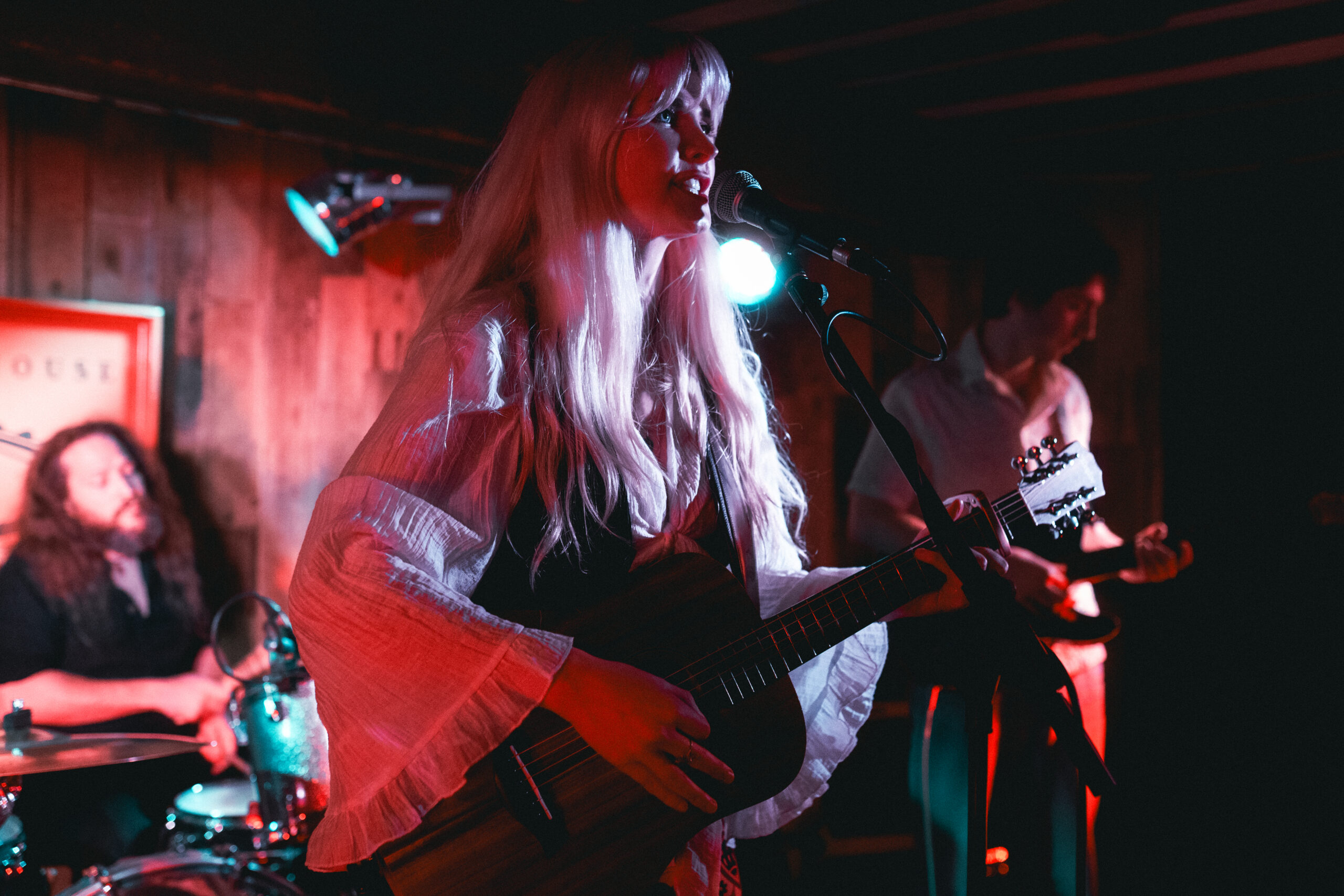 June Holland and band members performing live at Telford's Warehouse