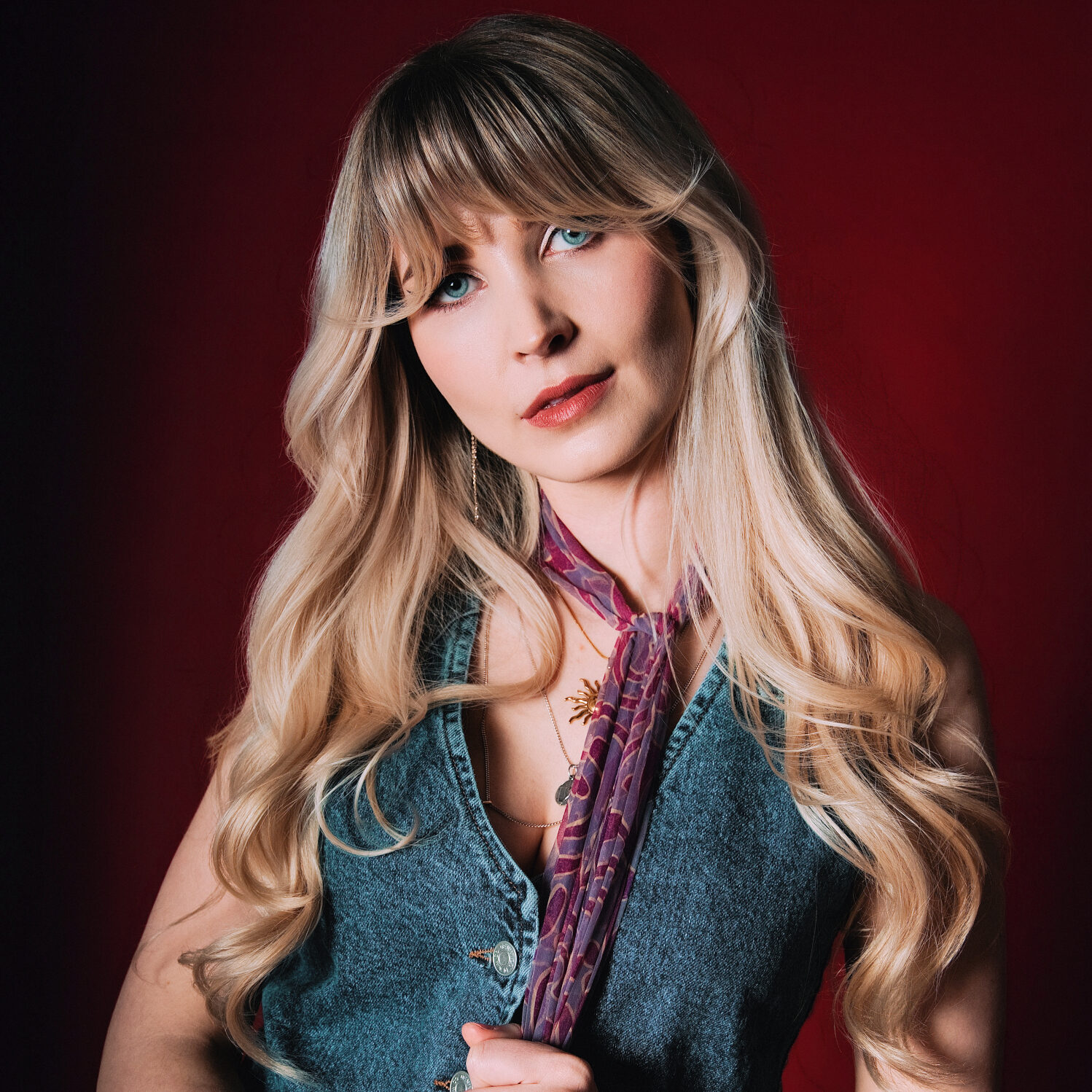 June Holland photo wearing denim waist coat