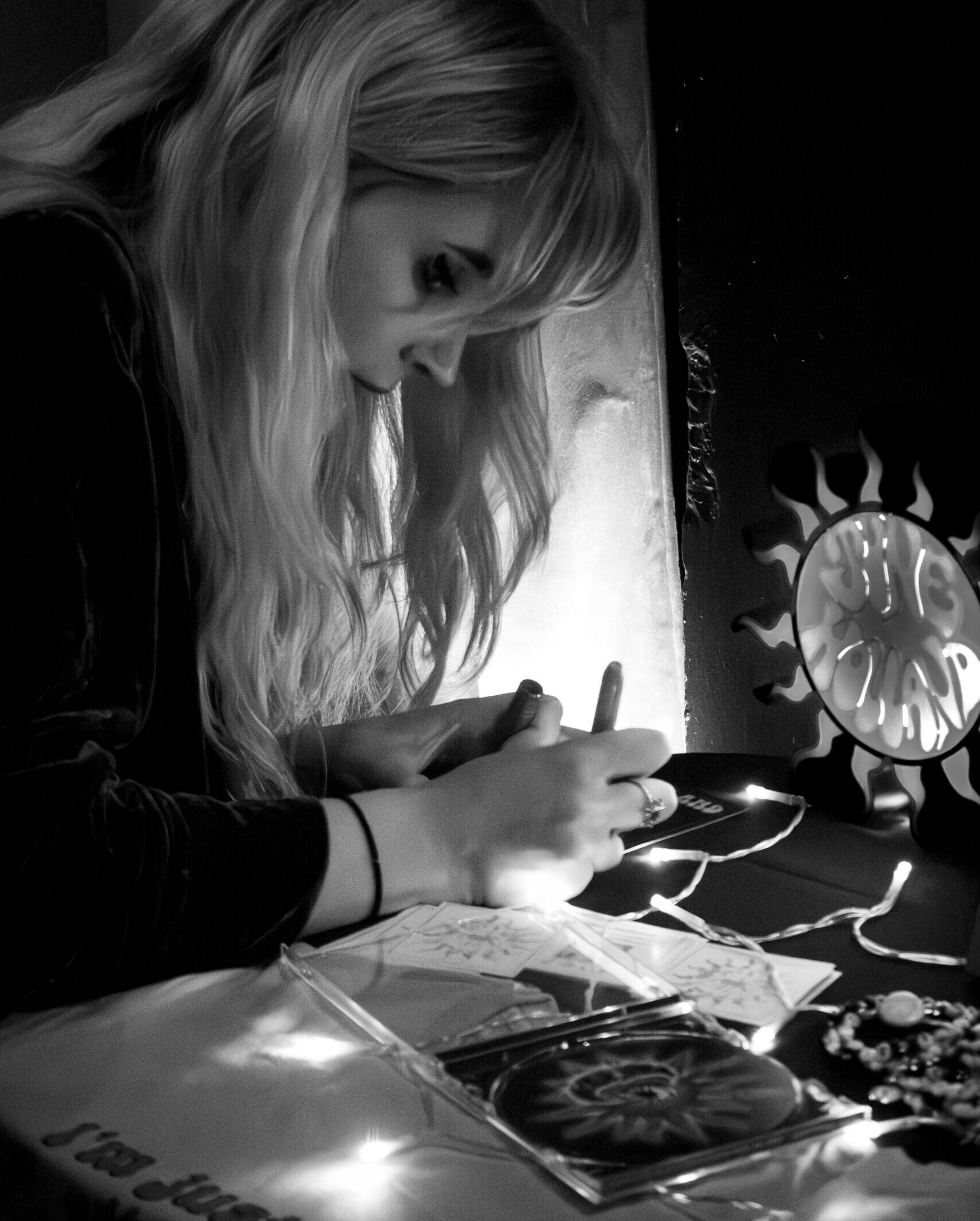June Holland Signing a CD at the Merch Table